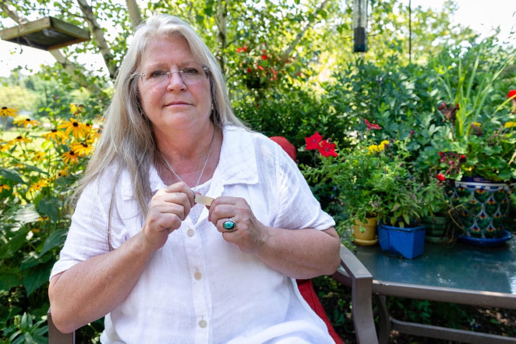 Susan Saran wears a chain bearing instructions that she not be resuscitated.