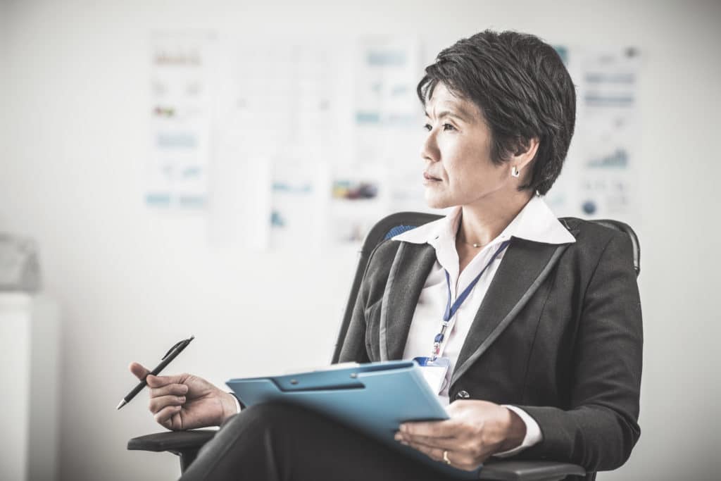 Portrait of female chief sitting in her office