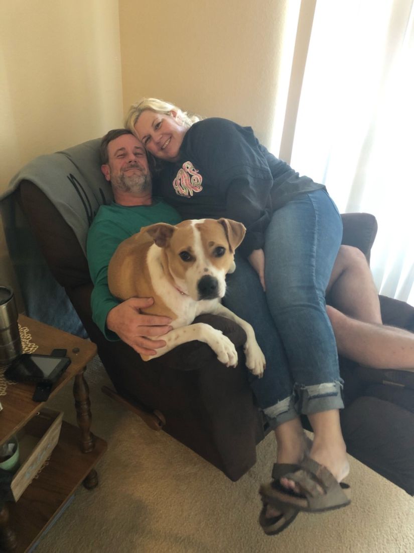 aftd_husband_and_wife_photo_with_their_dog aftd_husband_and_wife_photo_with_their_dog
