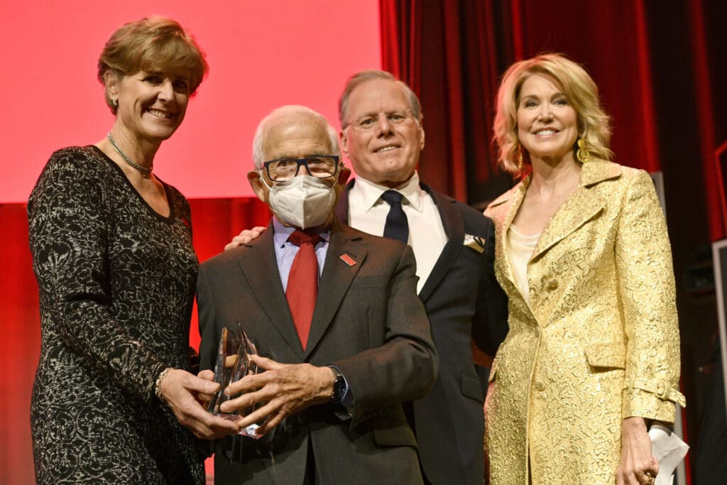 NEW YORK, NEW YORK - MARCH 30: Honoree Donald Newhouse receives his AFTD Champion Award from (L-R) Susan Dickinson, MSGC, AFTD Chief Executive Officer (CEO),  David Zaslav and Paula Zahn on stage during The Association For Frontotemporal Degeneration Hope Rising Benefit honoring Donald Newhouse at The Ziegfeld Ballroom on March 30, 2022 in New York City. (Photo by Eugene Gologursky/Getty Images for AFTD)