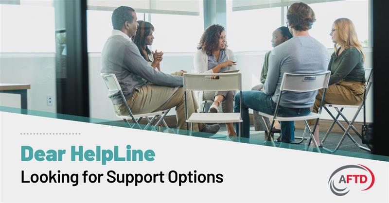 Suche nach Supportoptionen 2 - FBLI Text: Dear HelpLine - Looking for Support Options | Background: The members of a support group meet in person, sat in a circle on folding chairs