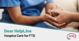 Text: Dear HelpLine - Hospice Care for FTD | Background: A healthcare provider holds someone's hands during an appointment