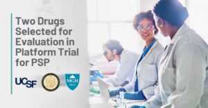 Title: Two Drugs Selected for Evaluation in Platform Trial for PSP | Background: A team of scientists work in a lab - two discuss their work while the third uses a microscope